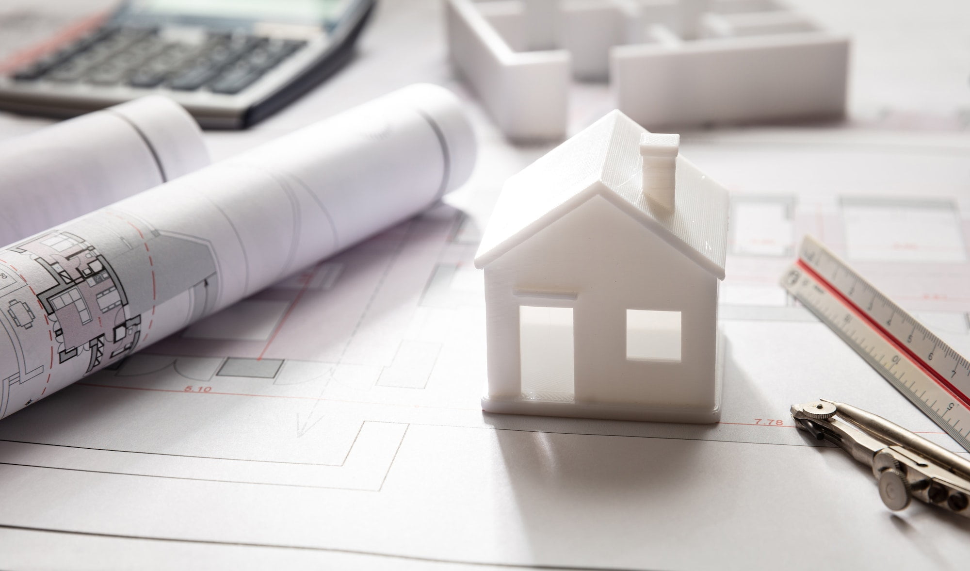 Residential building drawings and house model, Construction concept